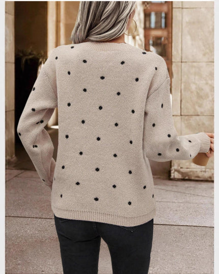 Fashionable polka dot print pullover sweater designed for a chic and casual look