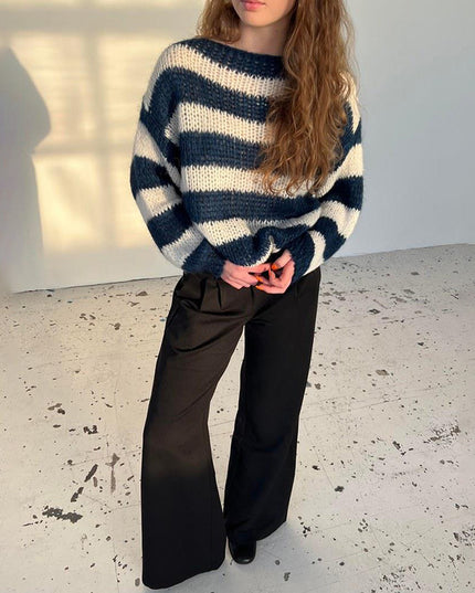 Women’s loose striped sweater with a modern design.